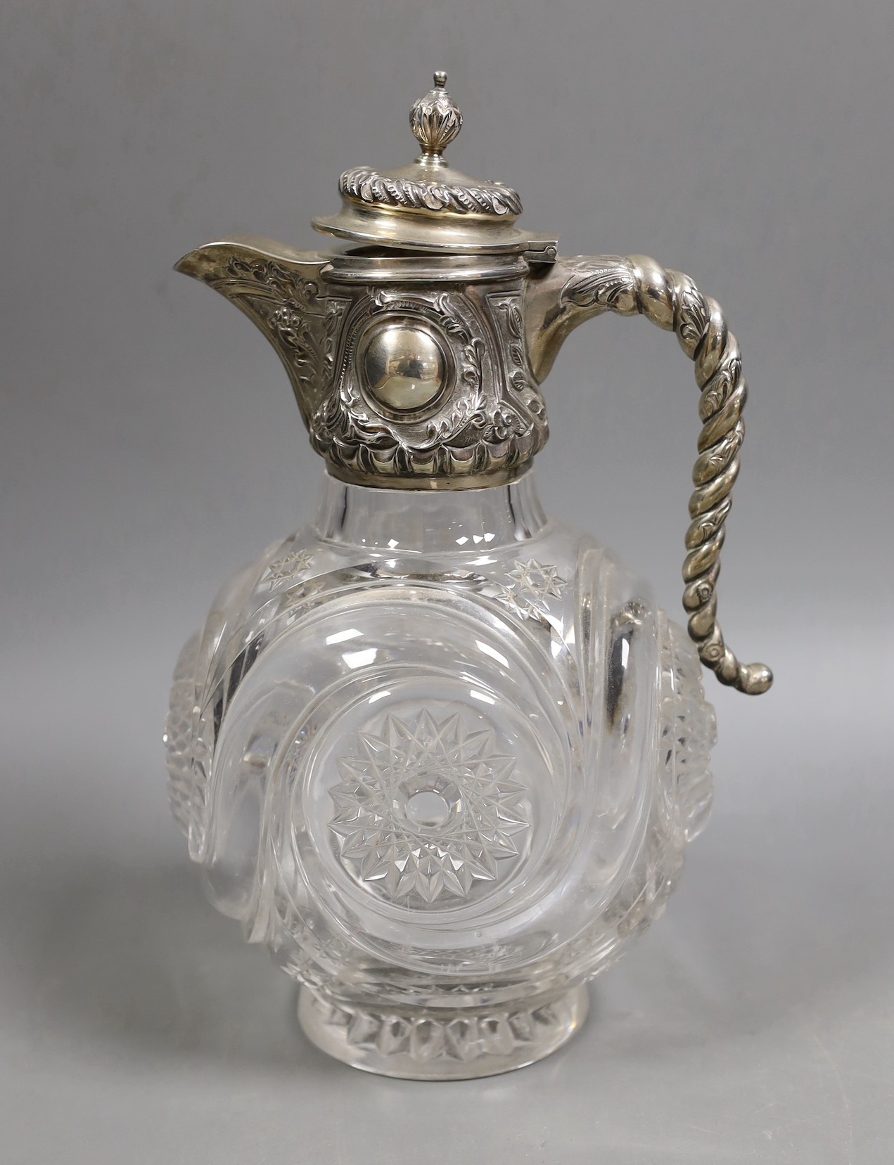 An Edwardian silver mounted cut glass claret jug, John Grinsell & Sons, Birmingham, 1902, 26cm.